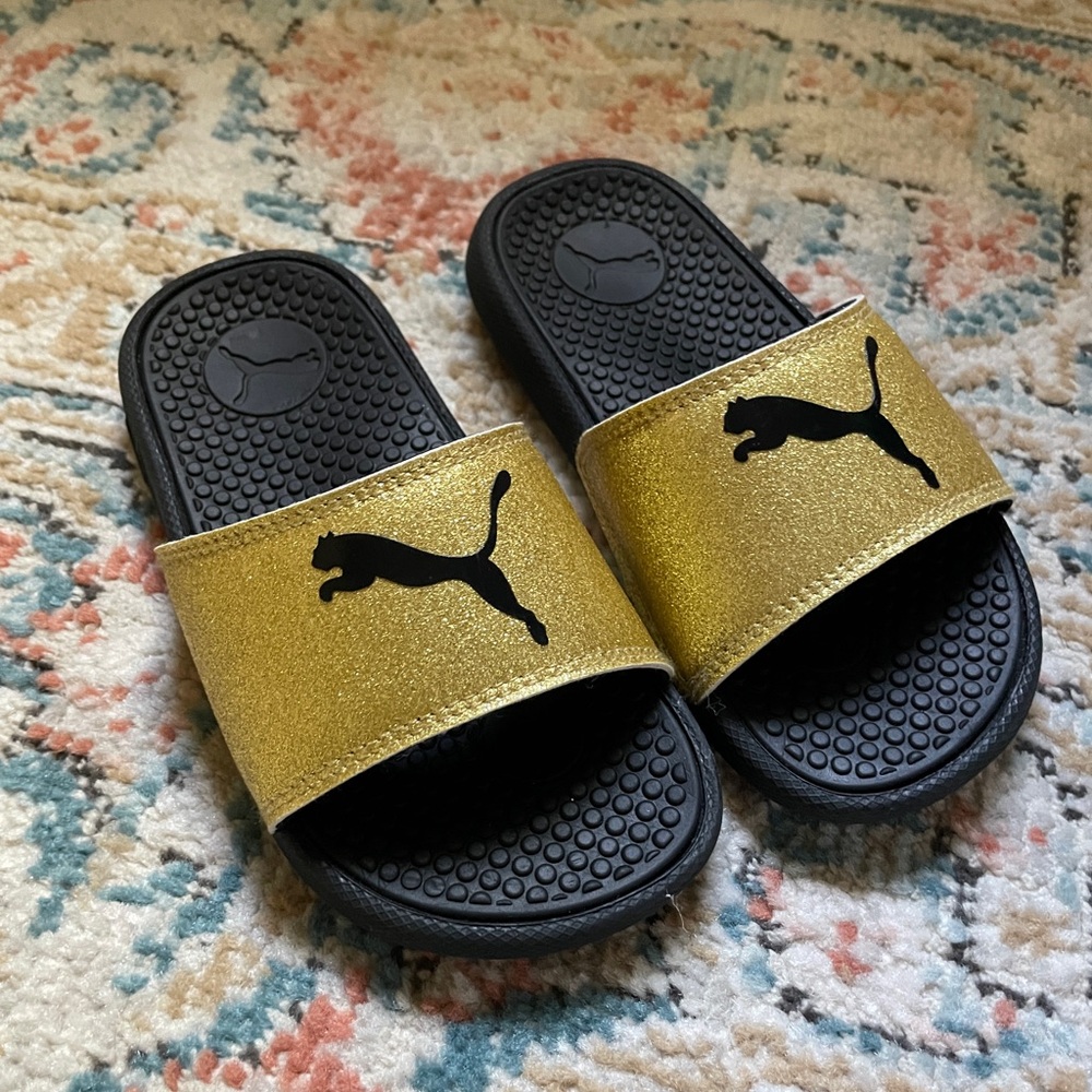 Puma girls black and gold slides 12